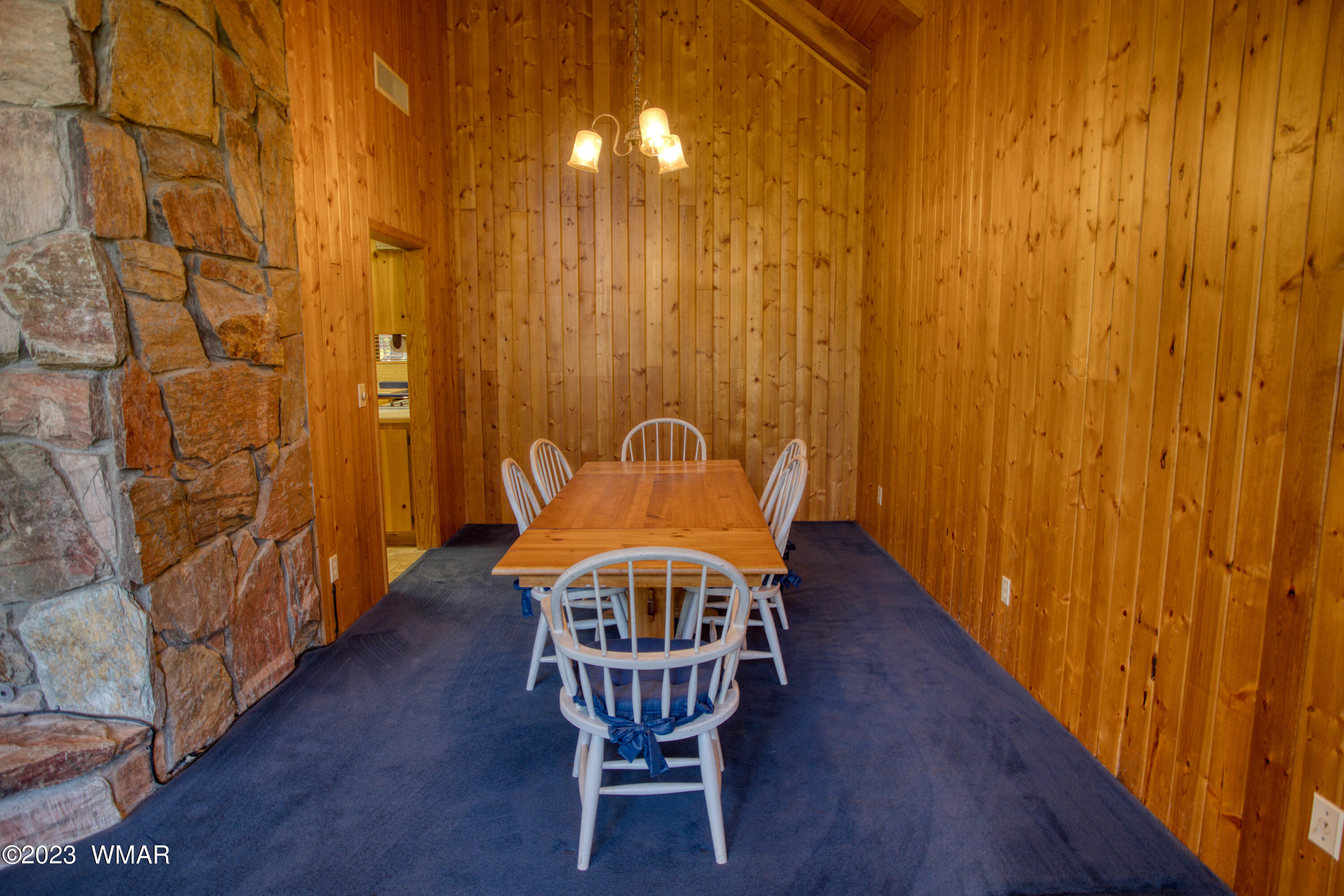 3288 Lake View Drive Pinetop, AZ 85935 - Photo 9 of 32 a view of a dining room with furniture and wooden floor