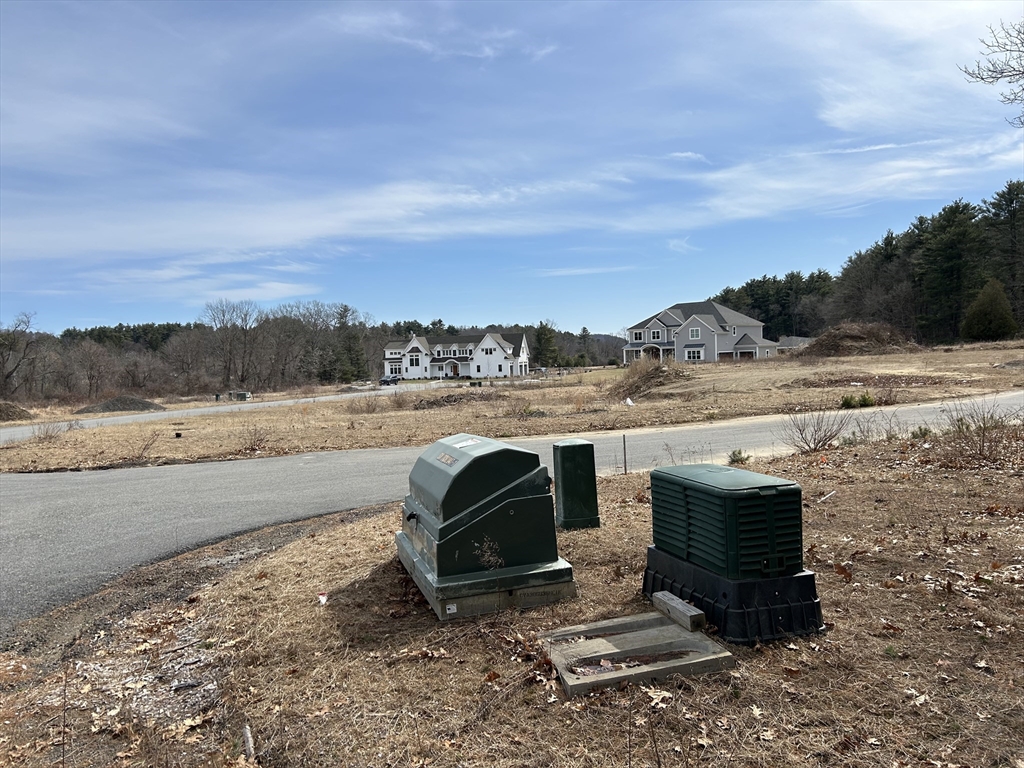 1 Ruby Circle Topsfield, MA 01983 - Photo 1 of 3 a view of a road with an ocean view