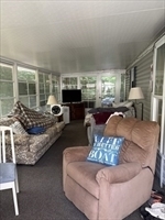 262 Shetucket Turnpike Griswold, CT 06351 - Photo 12 of 24 a living room with furniture and a fireplace