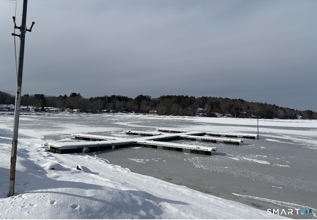262 Shetucket Turnpike Griswold, CT 06351 - Photo 2 of 24 a view of swimming pool with seating yard and lake view