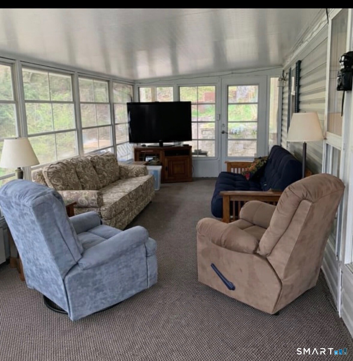 262 Shetucket Turnpike Griswold, CT 06351 - Photo 9 of 24 a living room with furniture and a flat screen tv