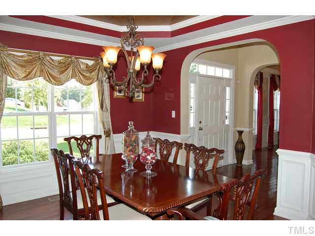 9219 Stone Mountain Road Raleigh, NC 27613 - Photo 5 of 25 a view of a dining room with furniture and chandelier