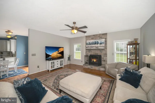 a large kitchen with a table and chairs in it