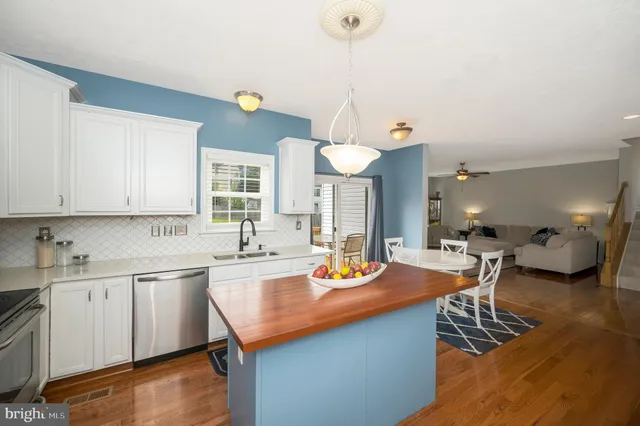 a kitchen with cabinets and window