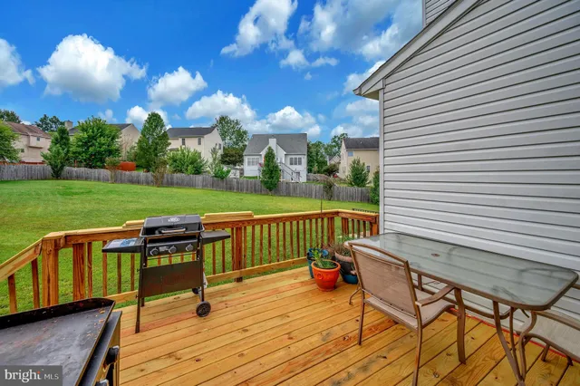 a view of a deck with wooden floor and seating space
