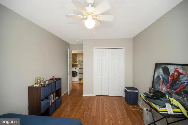 a bedroom with a bed and a desk