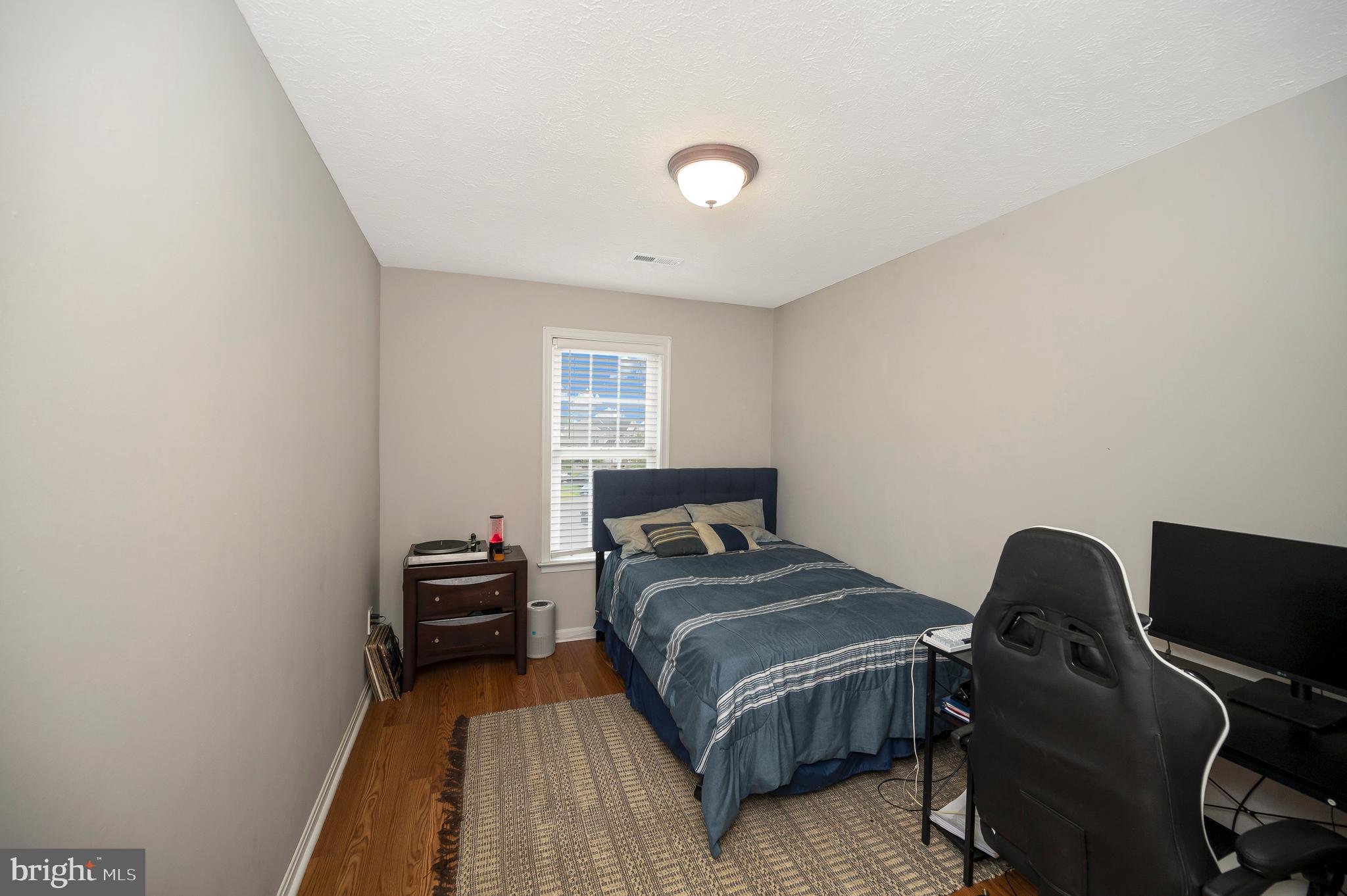 35342 Hawks Nest Court Locust Grove, VA 22508 - Photo 33 of 52 a bedroom with a bed and a desk