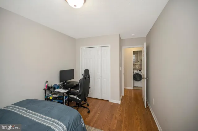a bathroom with a sink and mirror with toilet