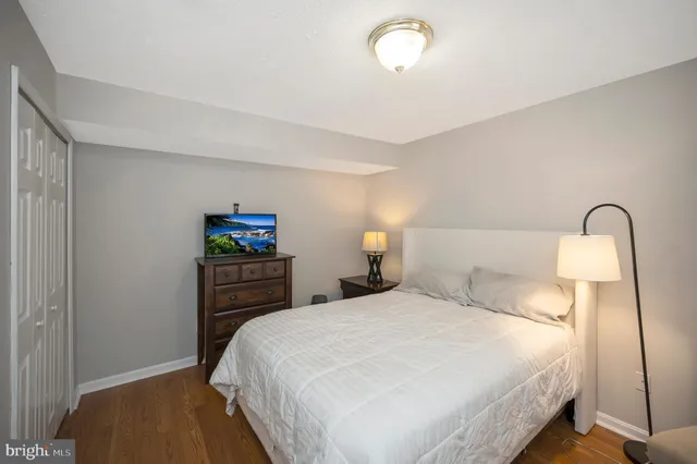 a bathroom with a toilet a sink and a mirror