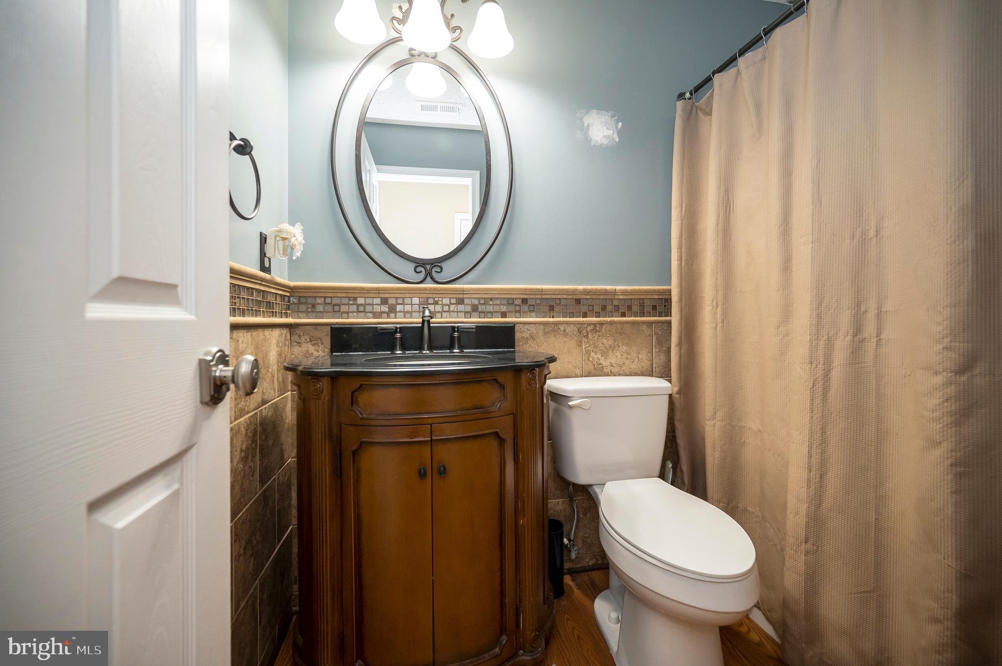 35342 Hawks Nest Court Locust Grove, VA 22508 - Photo 39 of 52 a bathroom with a toilet a sink and a mirror