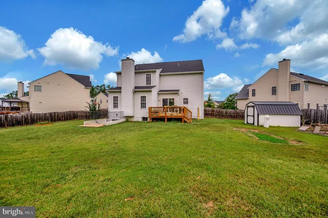 a front view of house with yard and outdoor seating