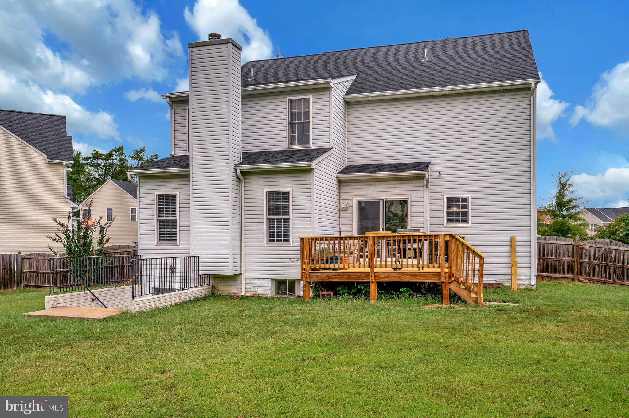 35342 Hawks Nest Court Locust Grove, VA 22508 - Photo 46 of 52 a front view of house with yard and outdoor seating