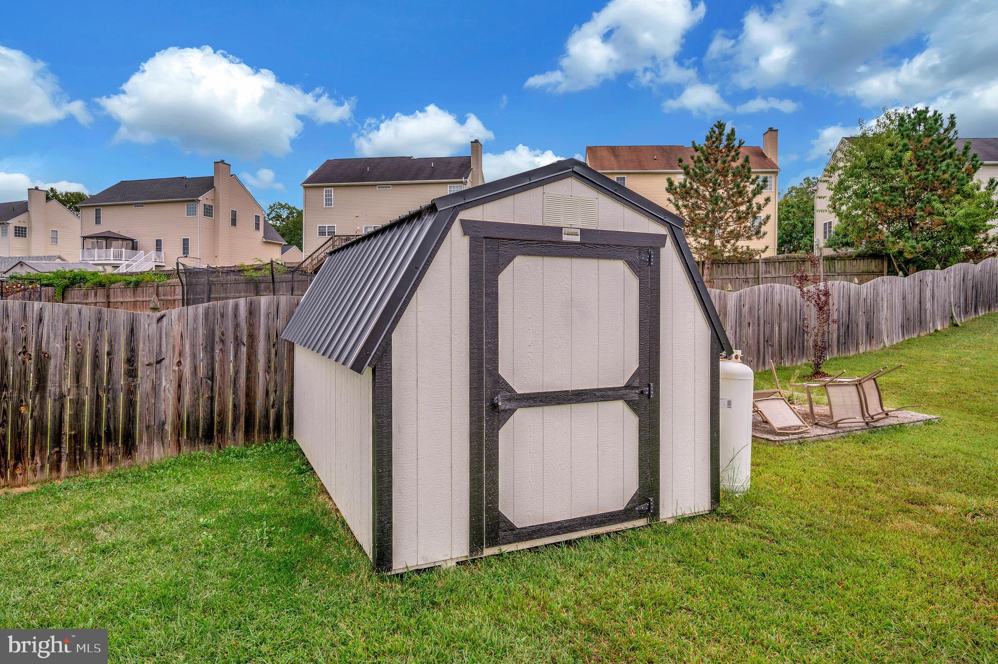 35342 Hawks Nest Court Locust Grove, VA 22508 - Photo 49 of 52 a view of a backyard with barn and wooden fence