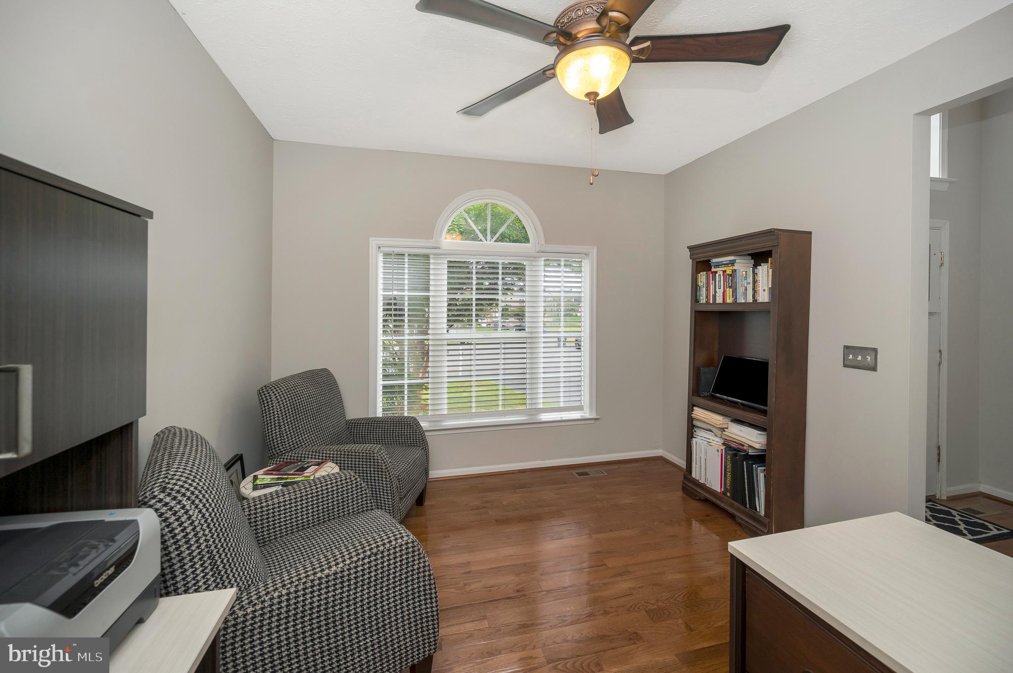 35342 Hawks Nest Court Locust Grove, VA 22508 - Photo 6 of 52 a living room with furniture a window and a flat screen tv