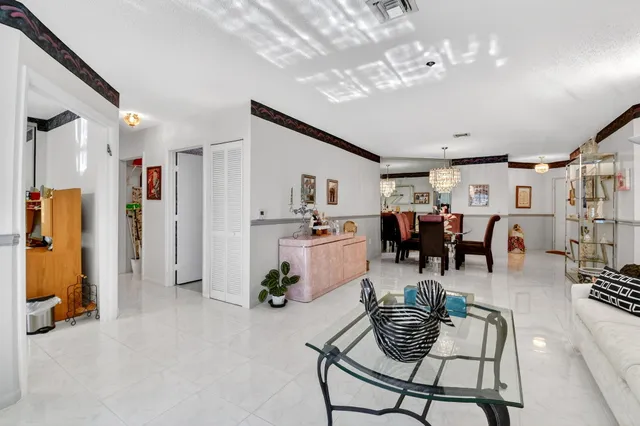 a kitchen with stainless steel appliances a stove a sink a refrigerator a cabinets and a refrigerator