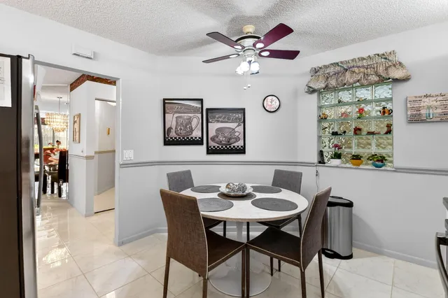 a bedroom with a bed and glass table