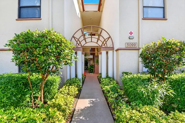 a view of a pathway in front of house