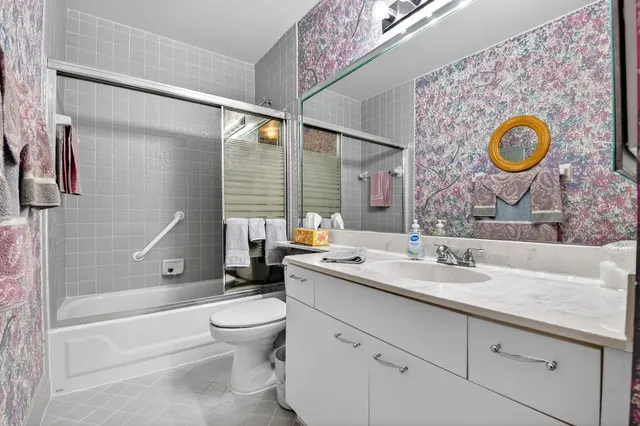 an aerial view of a residential houses with outdoor space and street view