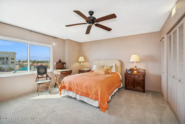 a bedroom with bed and window