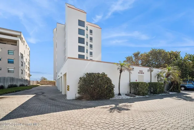 a view of a street with a building in the background