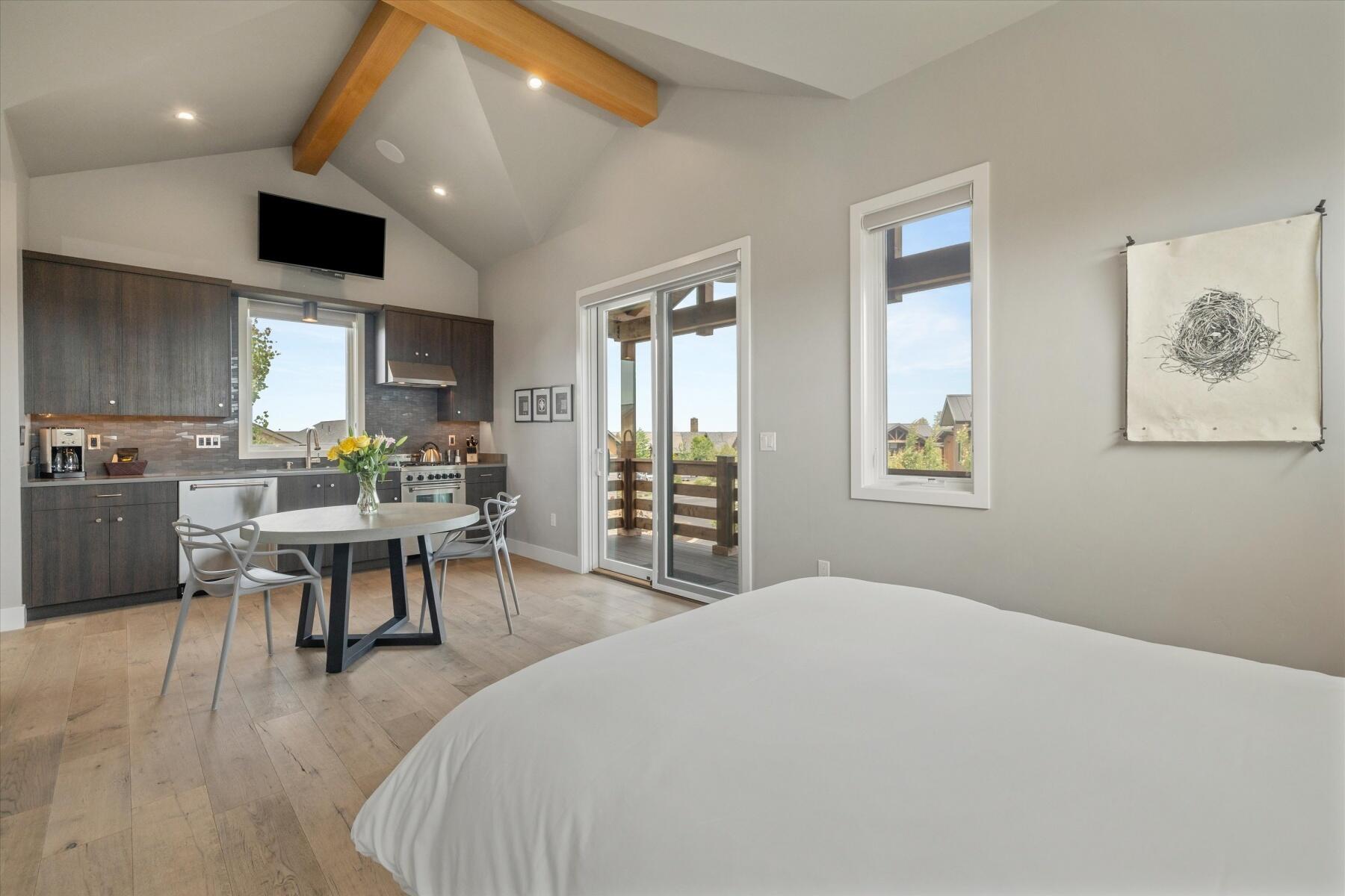 19208 Gateway Loop, Unit 17 Bend, OR 97702 - Photo 26 of 38 ADU is light and bright with a deck right off the kitchen.