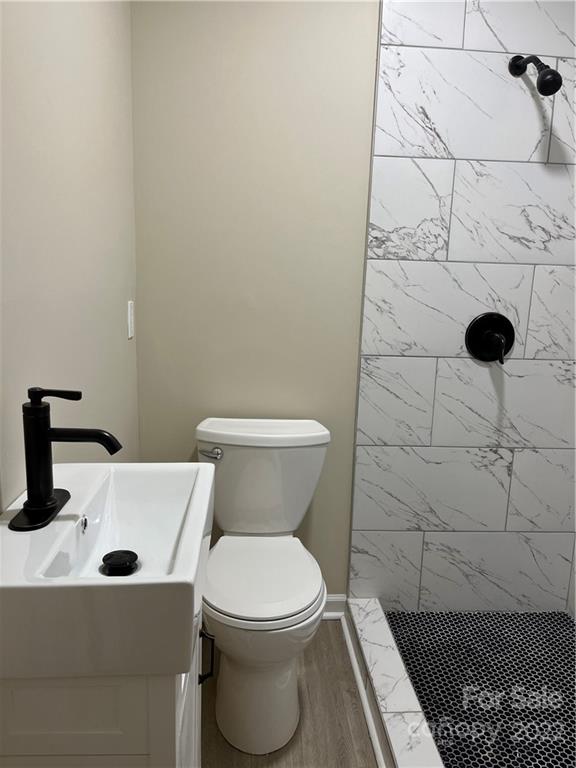220 Pine Road Mount Holly, NC 28120 - Photo 16 of 20 a bathroom with a sink and a toilet