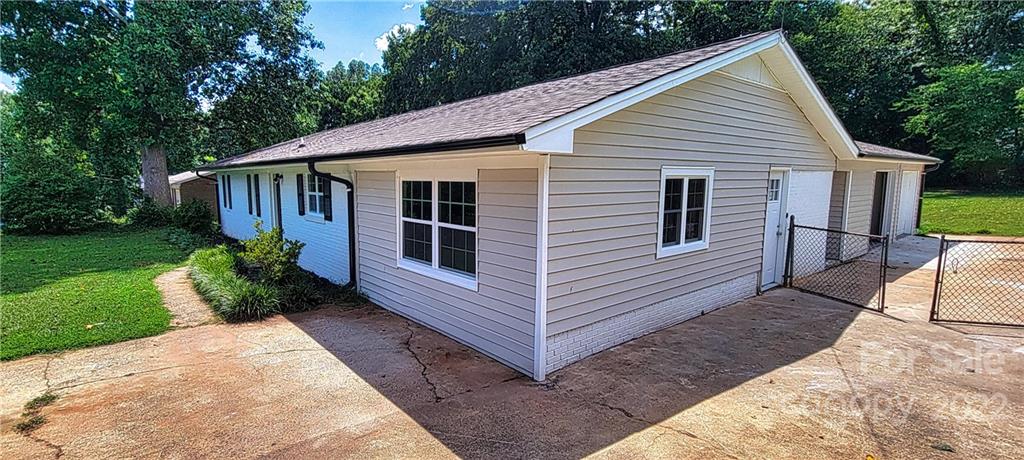 220 Pine Road Mount Holly, NC 28120 - Photo 17 of 20 a view of a house with yard and plants