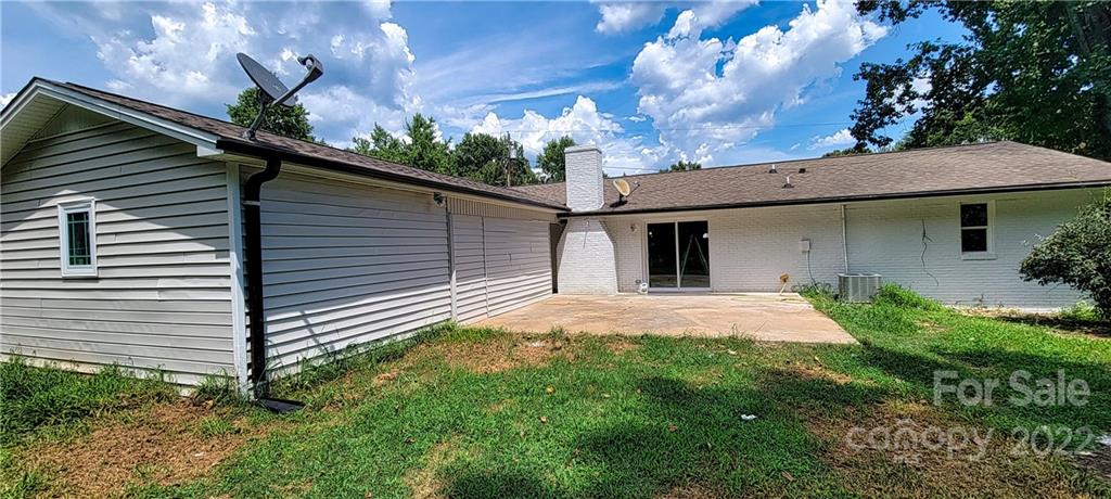 220 Pine Road Mount Holly, NC 28120 - Photo 18 of 20 a view of a house with a backyard