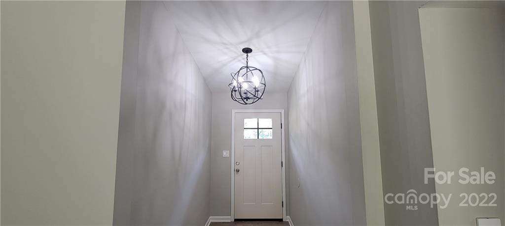 220 Pine Road Mount Holly, NC 28120 - Photo 2 of 20 a front view of a door with wooden floor