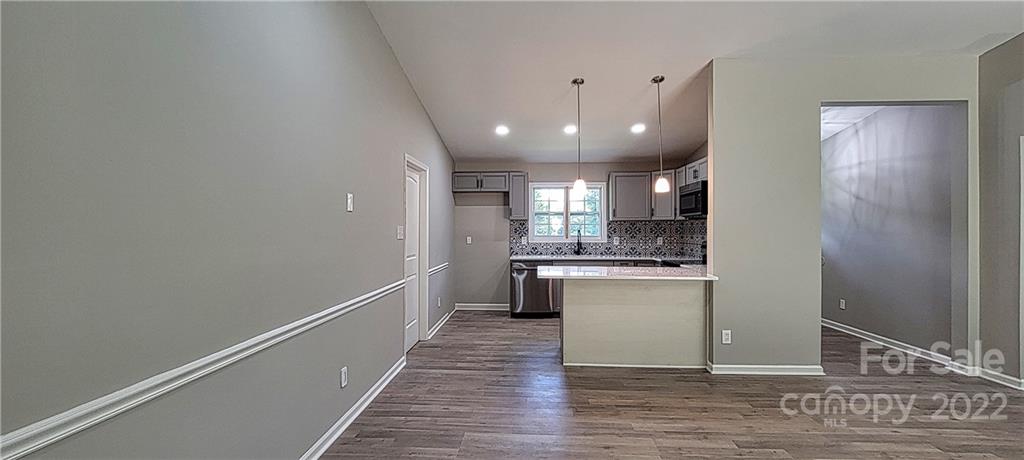 220 Pine Road Mount Holly, NC 28120 - Photo 4 of 20 a view of a kitchen from the hallway