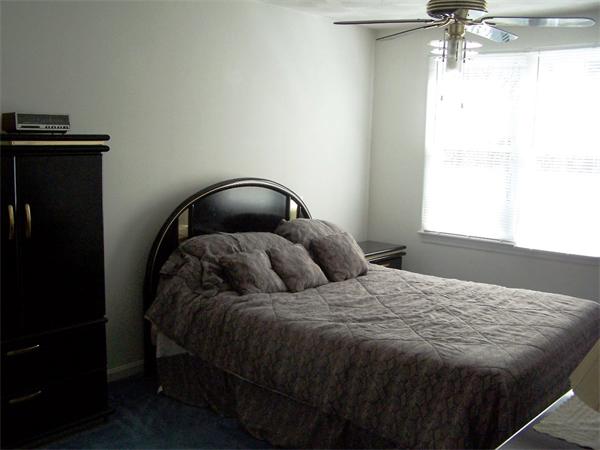 36 Blackbird Road Barnstable, MA 02648 - Photo 19 of 29 a bedroom with a bed and a window