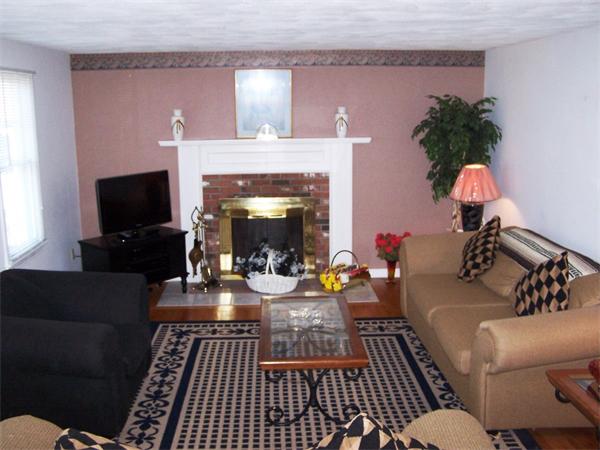 36 Blackbird Road Barnstable, MA 02648 - Photo 2 of 29 a living room with furniture fireplace and a flat screen tv