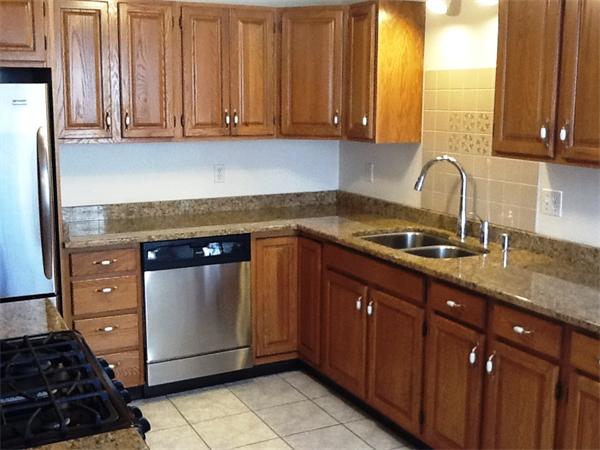36 Blackbird Road Barnstable, MA 02648 - Photo 3 of 29 a kitchen with granite countertop a sink and a stove