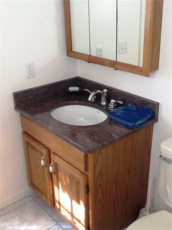 36 Blackbird Road Barnstable, MA 02648 - Photo 8 of 29 a bathroom with a sink and a mirror