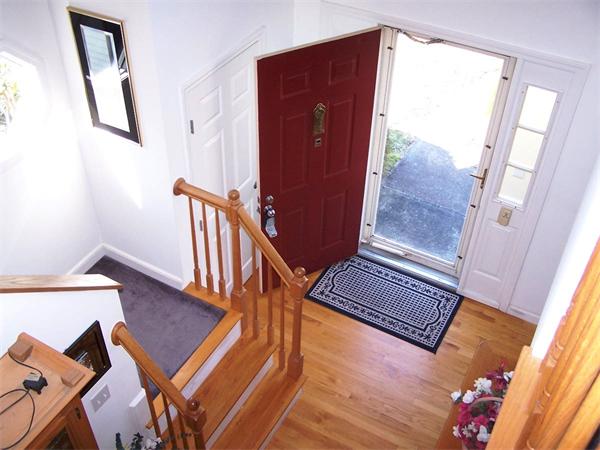 36 Blackbird Road Barnstable, MA 02648 - Photo 9 of 29 a view of a hallway with wooden floor and stairs