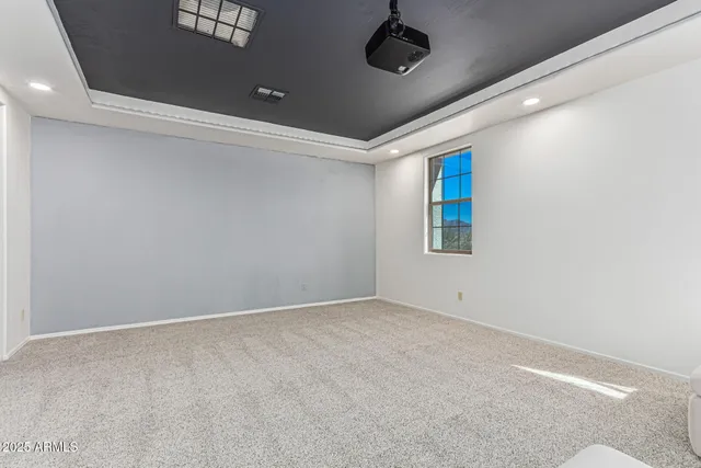a dining room with furniture and a book shelf