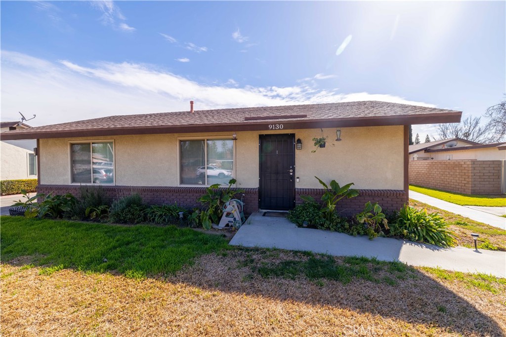 9130 Delano Drive Riverside, CA 92503 - Photo 1 of 1 a front view of a house with garden