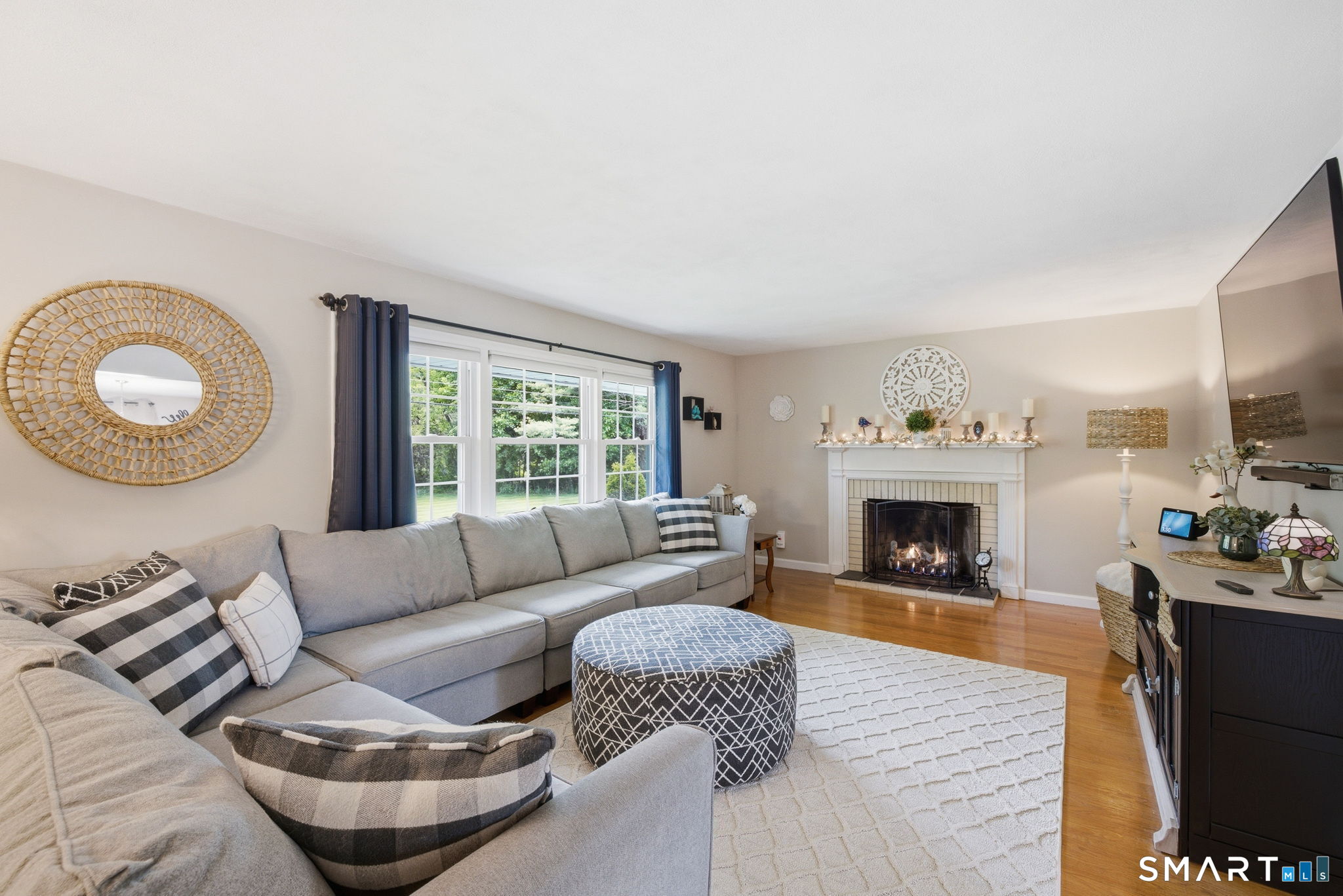 7 Stardust Drive Enfield, CT 06082 - Photo 2 of 38 a living room with furniture and a fireplace