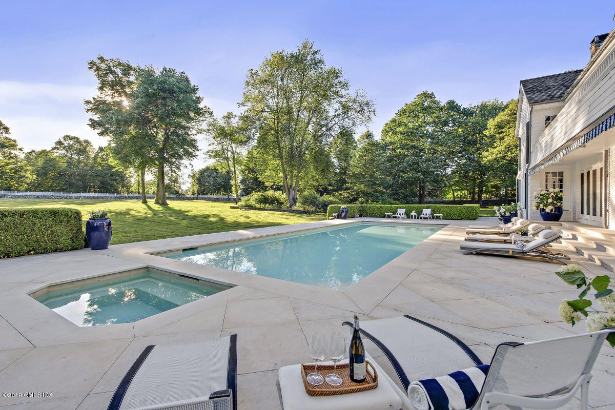 578 Riversville Road Greenwich, CT 06831 - Photo 15 of 38 a view of a patio with swimming pool