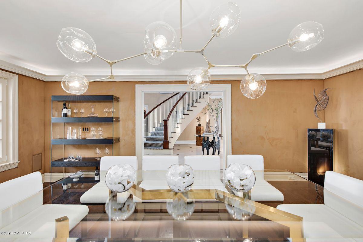 578 Riversville Road Greenwich, CT 06831 - Photo 17 of 38 a living room with furniture kitchen view and a chandelier