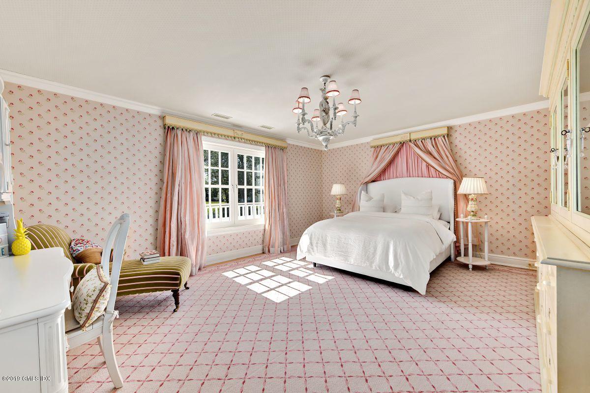 578 Riversville Road Greenwich, CT 06831 - Photo 28 of 38 a bedroom with a bed and a window