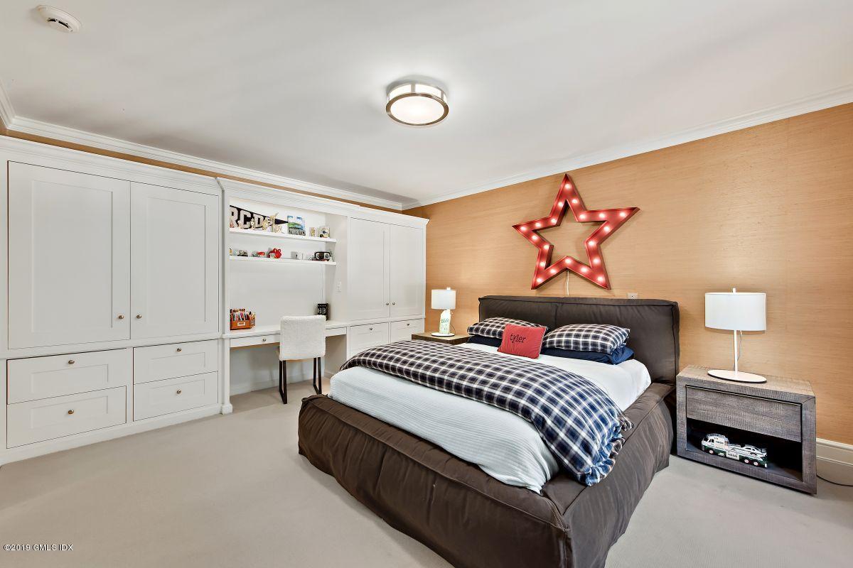 578 Riversville Road Greenwich, CT 06831 - Photo 29 of 38 a bedroom with a bed and a window