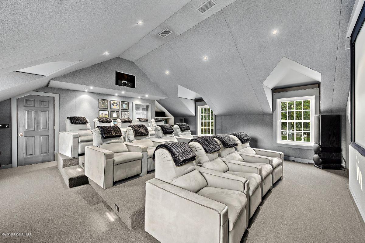 578 Riversville Road Greenwich, CT 06831 - Photo 30 of 38 a living room with furniture and a large window