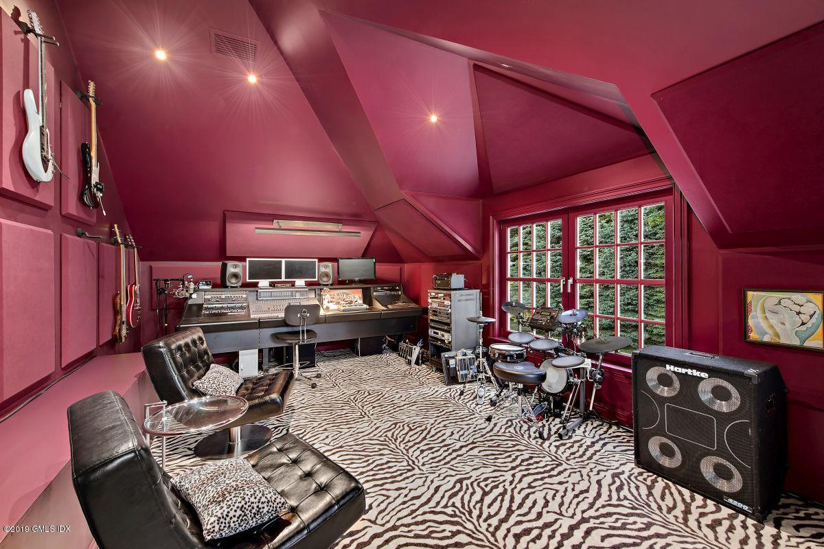 578 Riversville Road Greenwich, CT 06831 - Photo 32 of 38 a living room with furniture a air conditioner and a large window