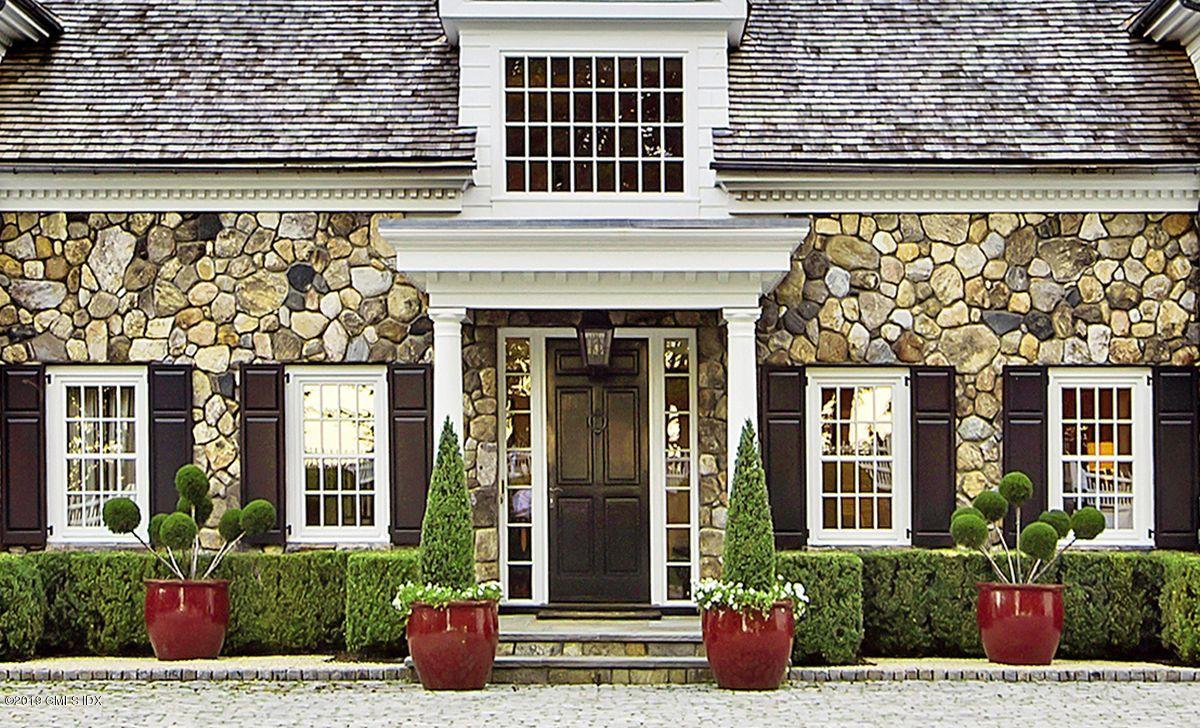 578 Riversville Road Greenwich, CT 06831 - Photo 4 of 38 front view of a brick house with potted plants