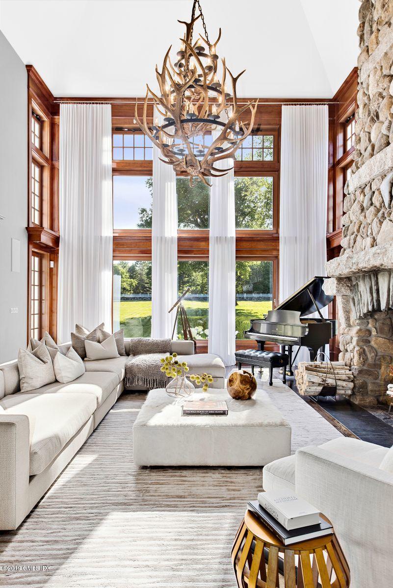 578 Riversville Road Greenwich, CT 06831 - Photo 5 of 38 a living room with furniture and large windows