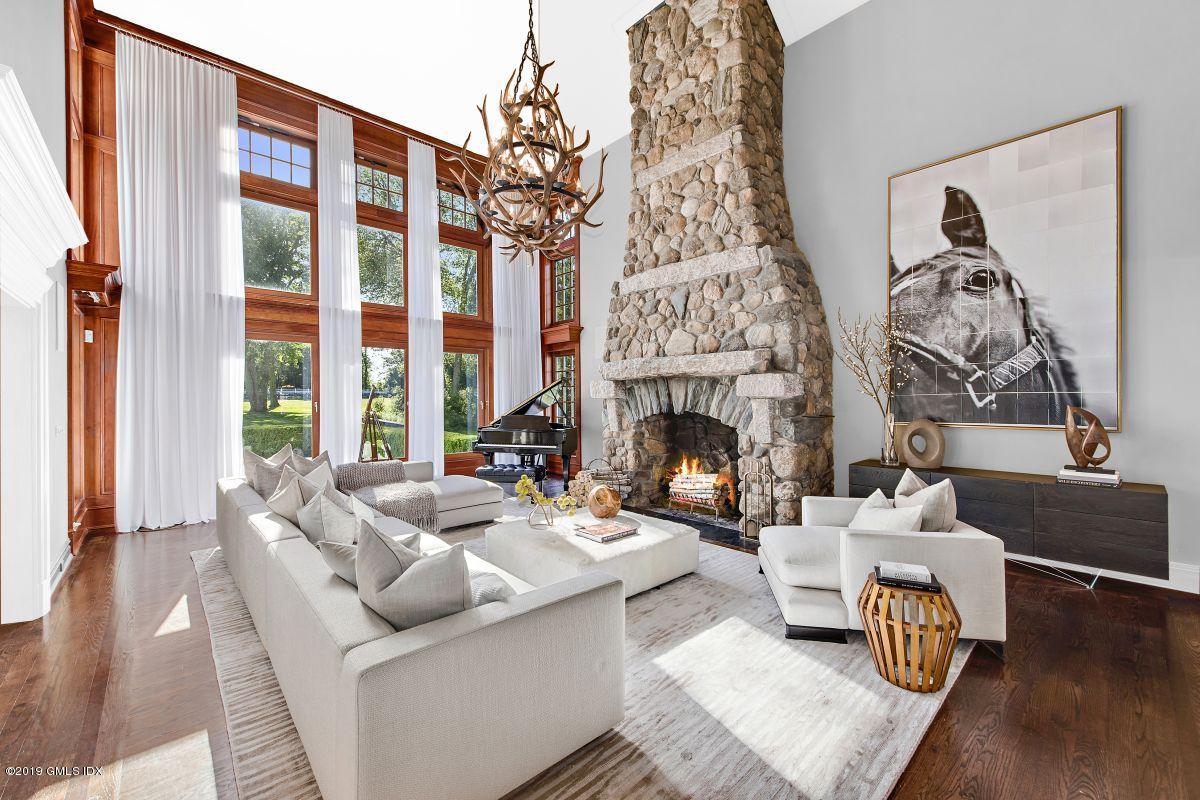 578 Riversville Road Greenwich, CT 06831 - Photo 7 of 38 a living room with furniture and a fireplace