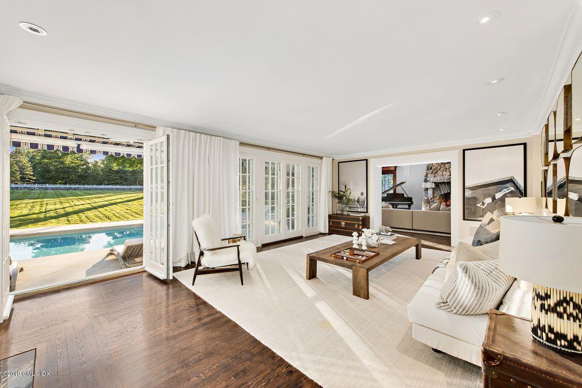 578 Riversville Road Greenwich, CT 06831 - Photo 10 of 38 a view of a living room with furniture and floor to ceiling window