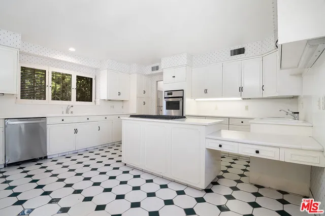 a kitchen with a sink and a window