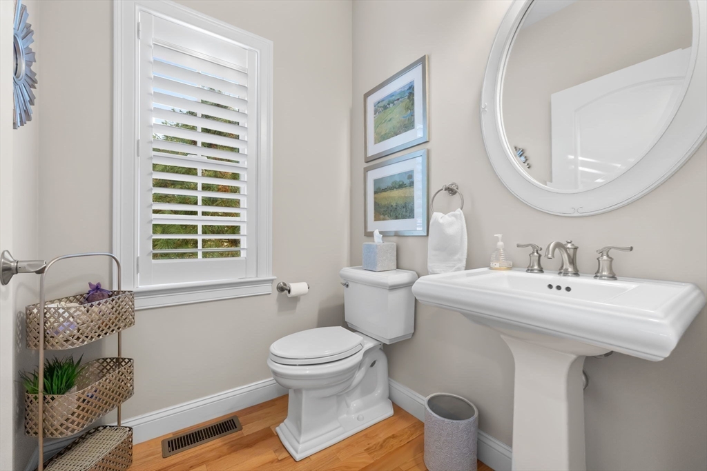 11 Cranberry Lane, Unit 11 Middleton, MA 01949 - Photo 8 of 29 a bathroom with a sink toilet and a mirror